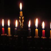 Why men are obligated to light the Chanukah candles?